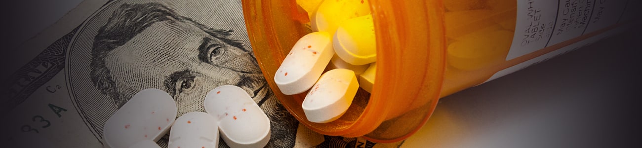 Banner picture of pills over a bill