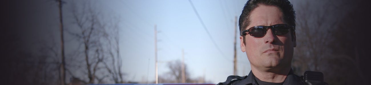 Banner picture of a police officer with sunglasses