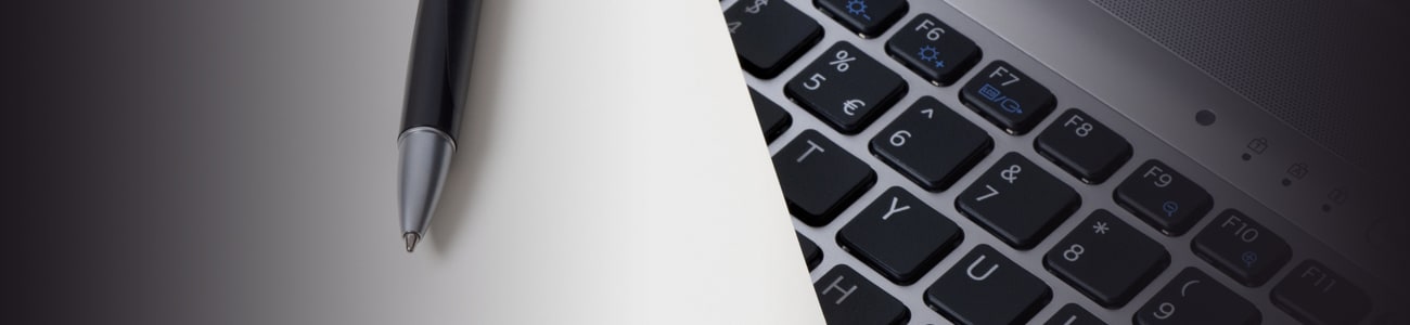 Banner picture of a pen over a computer keyboard