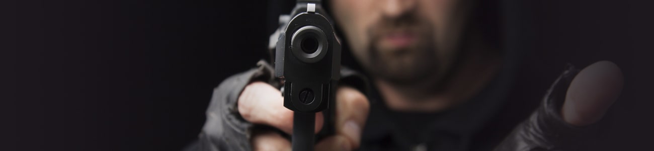 Banner picture of a person holding a gun